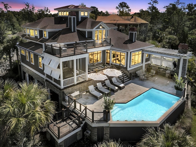 1913 Mooring Line Way, Mount Pleasant, SC 29466 - rear view of property featuring roof with shingles, an outdoor pool, a balcony, a patio, and a pergola