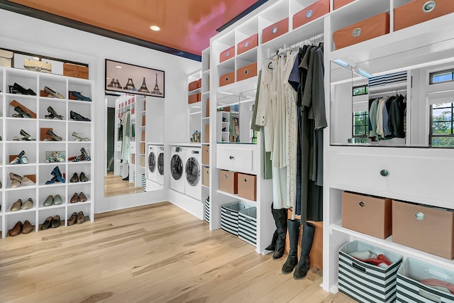 washroom with washer and dryer and hardwood / wood-style flooring