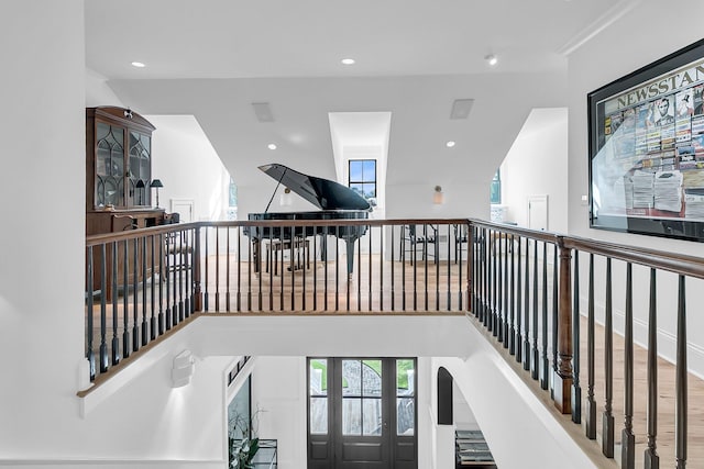 stairs featuring hardwood / wood-style floors