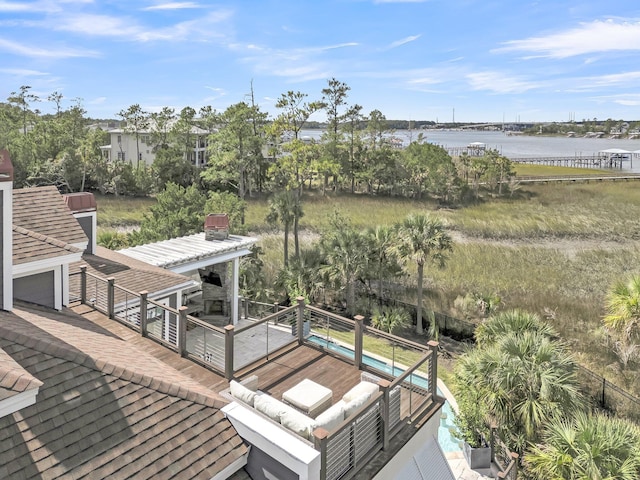 wooden terrace featuring a water view and an outdoor hangout area