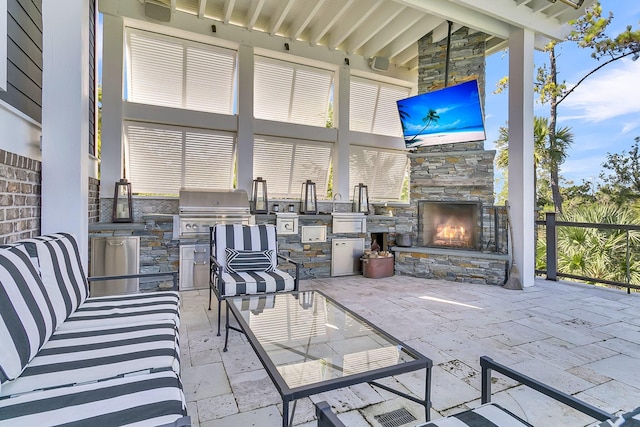 1913 Mooring Line Way, Mount Pleasant, SC 29466 - view of patio with area for grilling, an outdoor stone fireplace, and exterior kitchen