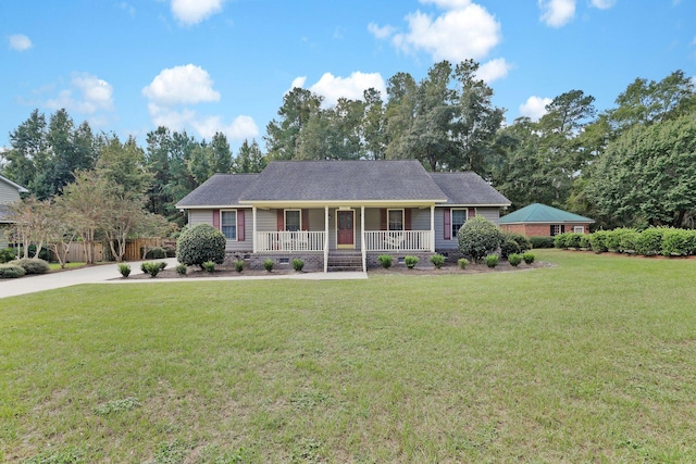 ranch-style home featuring a front yard and covered porch