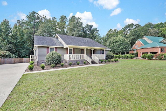 view of front of home featuring a front yard and covered porch