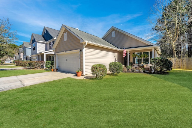 view of front of property with a garage, concrete driveway, a front yard, and fence