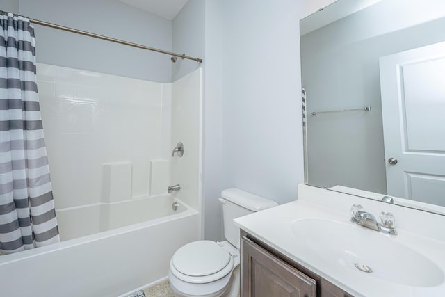 bathroom featuring shower / tub combo with curtain, vanity, and toilet