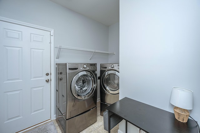 laundry area featuring laundry area and washer and clothes dryer