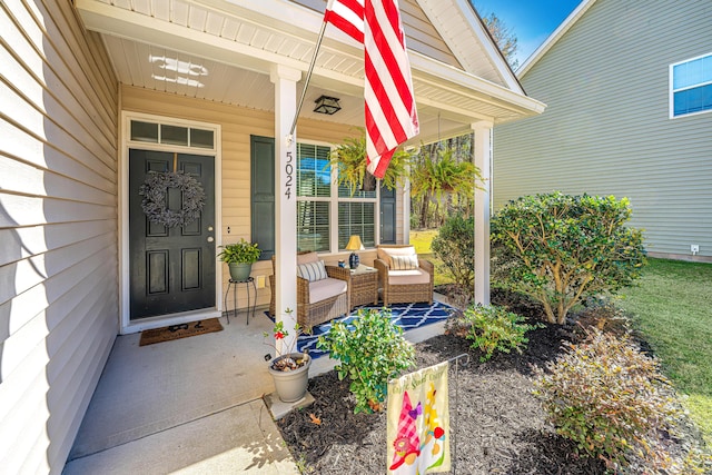 entrance to property featuring a porch