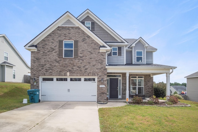 craftsman inspired home with covered porch, a front yard, and a garage