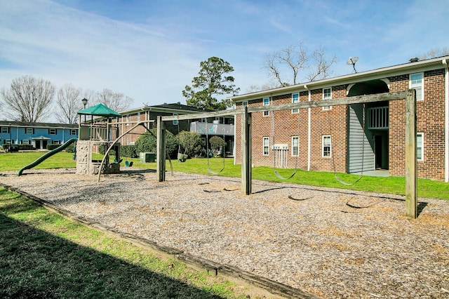 view of jungle gym featuring a lawn