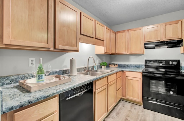 kitchen with light brown cabinets, a textured ceiling, black appliances, light hardwood / wood-style floors, and sink