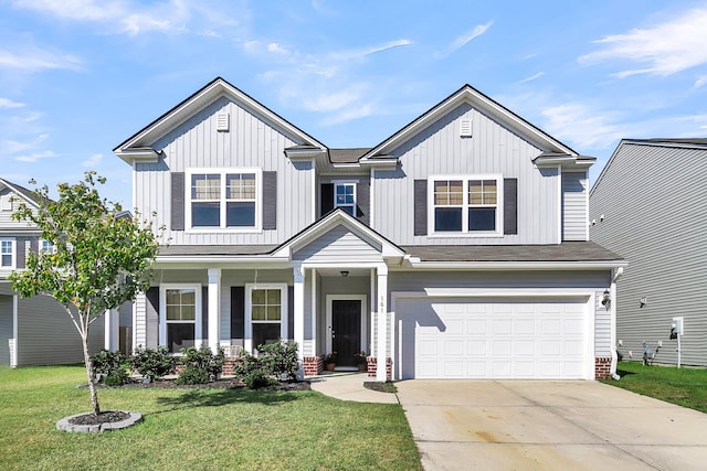 view of front of home featuring a garage and a front yard