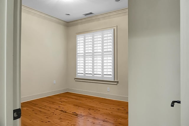 4252 Faber Place Dr Unit 203, North Charleston, SC 29405 - spare room with crown molding, wood finished floors, and baseboards