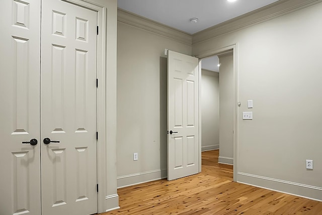 4252 Faber Place Dr Unit 203, North Charleston, SC 29405 - unfurnished bedroom with crown molding, light wood finished floors, and baseboards