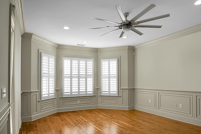 4252 Faber Place Dr Unit 203, North Charleston, SC 29405 - unfurnished room with wood finished floors, ornamental molding, a ceiling fan, wainscoting, and recessed lighting