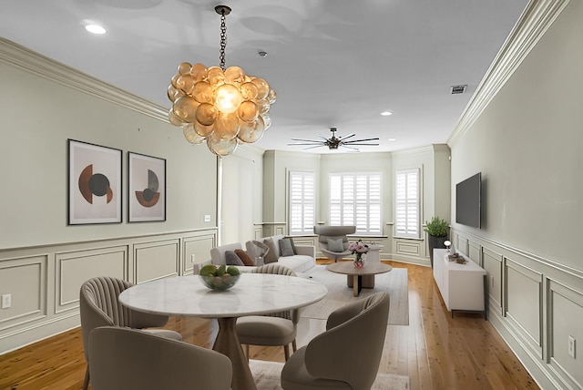 4252 Faber Place Dr Unit 203, North Charleston, SC 29405 - dining area with a decorative wall, ornamental molding, a chandelier, ceiling fan, and recessed lighting