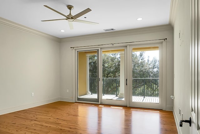 4252 Faber Place Dr Unit 203, North Charleston, SC 29405 - unfurnished room featuring healthy amount of natural light, crown molding, wood finished floors, a ceiling fan, and baseboards