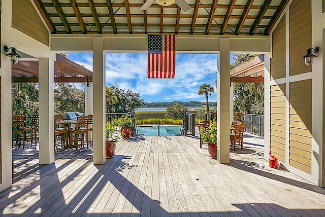 4252 Faber Place Dr Unit 203, North Charleston, SC 29405 - wooden deck with outdoor dining area, a water view, ceiling fan, and an outdoor pool