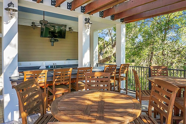 4252 Faber Place Dr Unit 203, North Charleston, SC 29405 - wooden deck featuring outdoor dining space and a ceiling fan