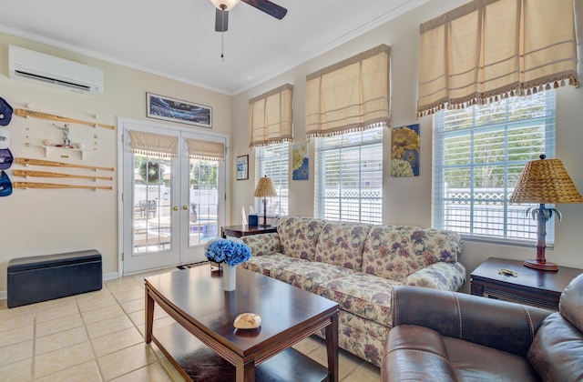 living room with an AC wall unit, plenty of natural light, crown molding, ceiling fan, and french doors