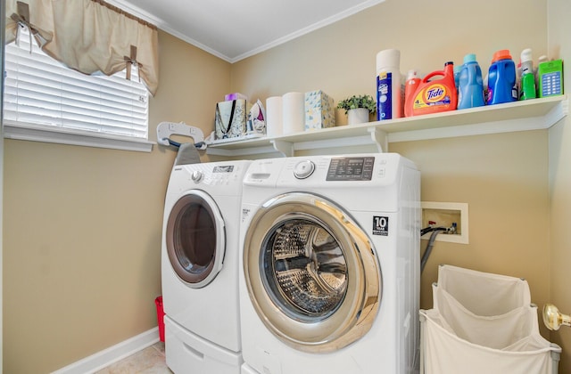 washroom with washing machine and clothes dryer, baseboards, crown molding, and tile patterned flooring