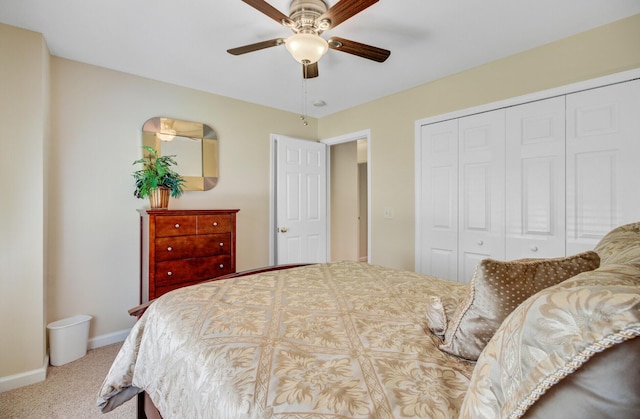 bedroom with a closet, carpet floors, baseboards, and ceiling fan