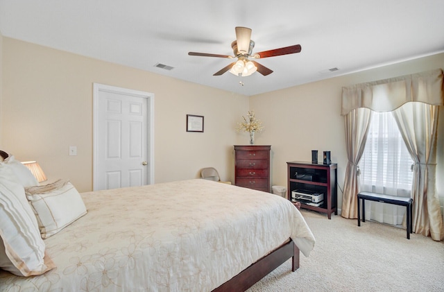 bedroom featuring light carpet and ceiling fan