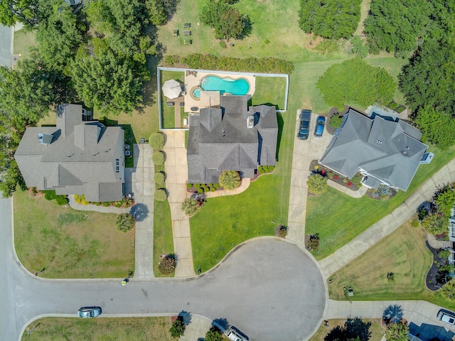 aerial view of property and surrounding area featuring a pool area