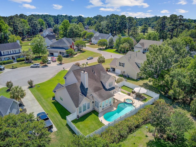 aerial perspective of suburban area featuring a pool area