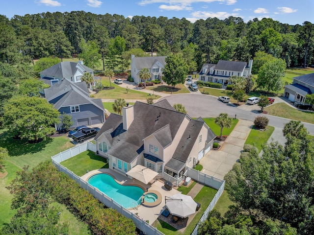 aerial view of residential area with a pool