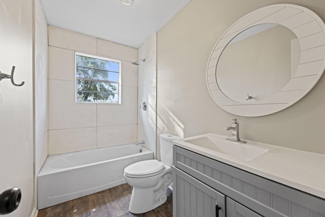 121 Harrison St, Varnville, SC 29944 - full bathroom with toilet, wood finished floors, vanity, and washtub / shower combination