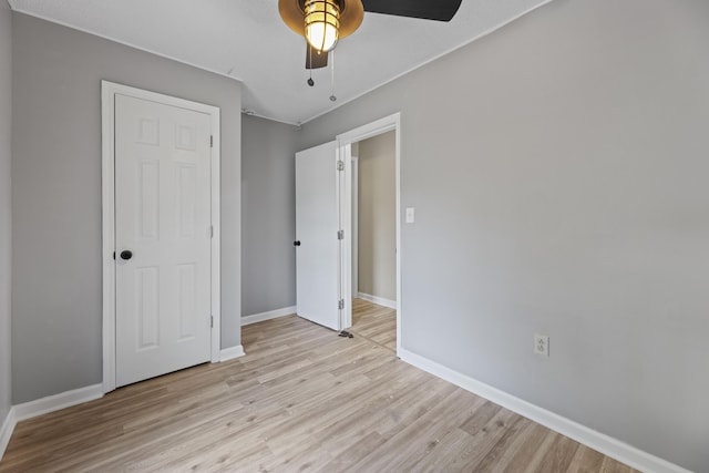 121 Harrison St, Varnville, SC 29944 - unfurnished bedroom with light wood-style floors, baseboards, and a ceiling fan