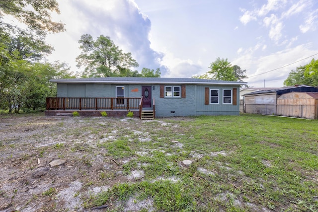 121 Harrison St, Varnville, SC 29944 - view of front of house featuring a deck, crawl space, and brick siding