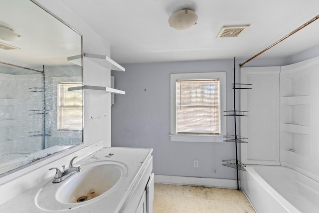 full bathroom with vanity, visible vents, and baseboards