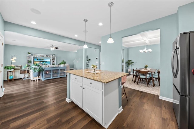 3055 Matthews Dr, Sumter, SC 29154 - kitchen featuring freestanding refrigerator, white cabinetry, light stone countertops, recessed lighting, and dark wood-style floors
