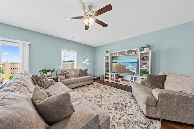 3055 Matthews Dr, Sumter, SC 29154 - living area with ceiling fan and dark wood-type flooring