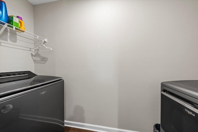 3055 Matthews Dr, Sumter, SC 29154 - washroom featuring separate washer and dryer and baseboards