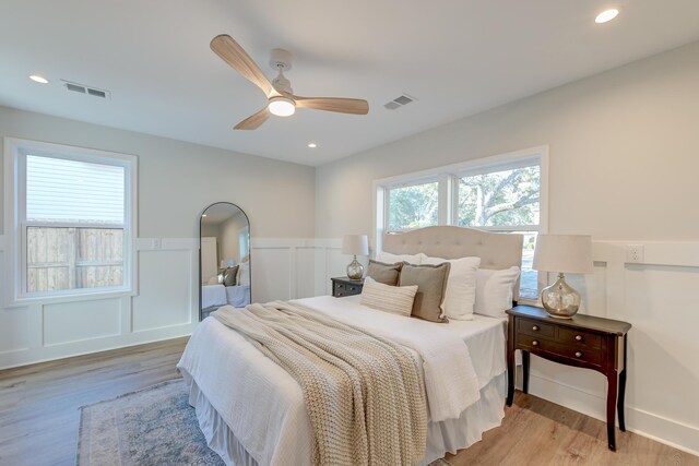 bedroom with ceiling fan and light wood-type flooring