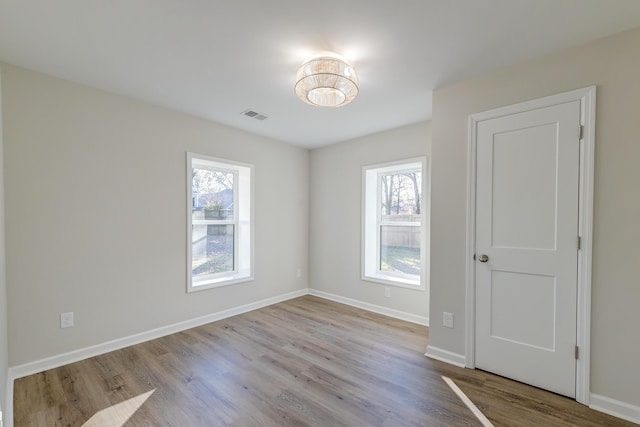 spare room with light hardwood / wood-style floors