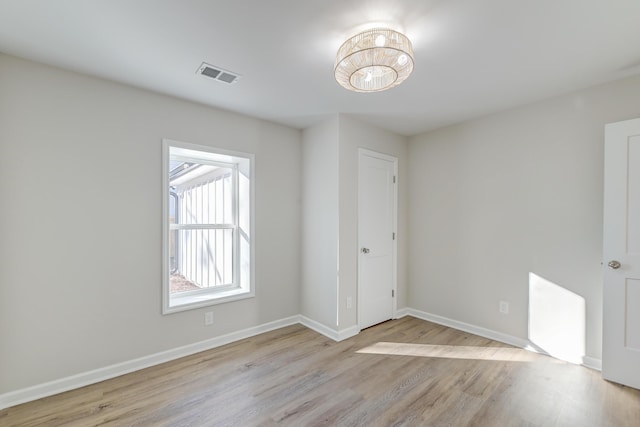 unfurnished bedroom featuring light wood-type flooring