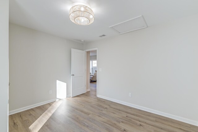 unfurnished room featuring light wood-type flooring