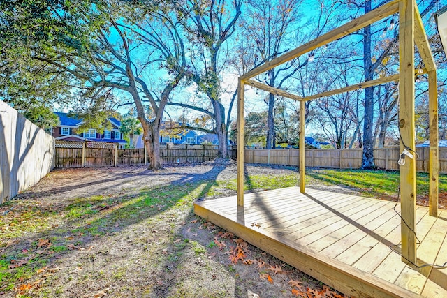 view of yard with a wooden deck