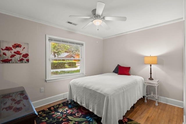 672 W Oak Forest Dr, Charleston, SC 29407 - bedroom with wood finished floors, baseboards, ornamental molding, and a ceiling fan
