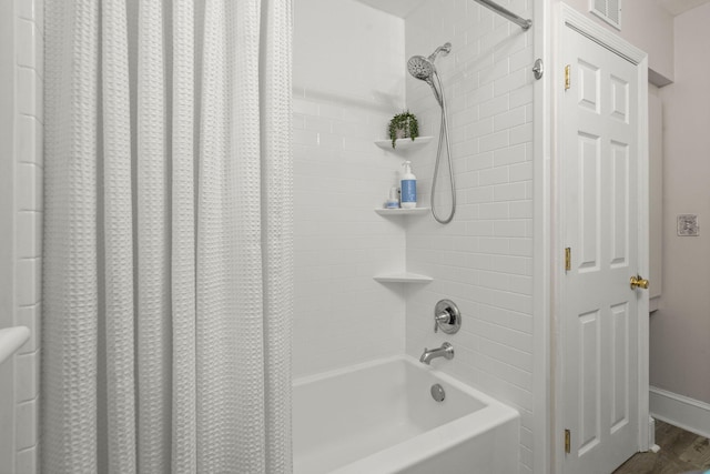 672 W Oak Forest Dr, Charleston, SC 29407 - bathroom with shower / bathtub combination with curtain, baseboards, and wood finished floors