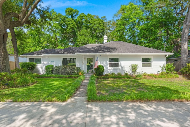 672 W Oak Forest Dr, Charleston, SC 29407 - view of front of property featuring a front yard and a chimney