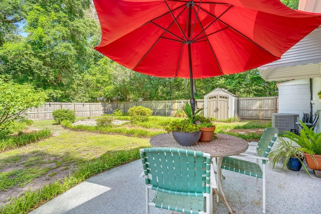 672 W Oak Forest Dr, Charleston, SC 29407 - view of patio / terrace with a shed, a fenced backyard, an outdoor structure, and cooling unit