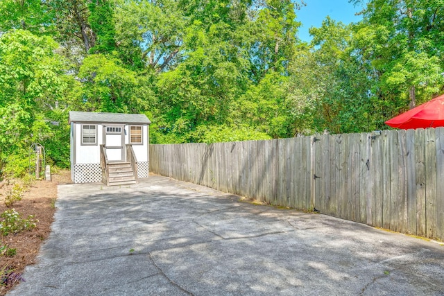 672 W Oak Forest Dr, Charleston, SC 29407 - view of patio with fence, an outbuilding, and entry steps