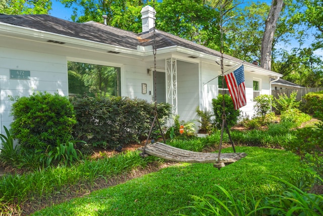 672 W Oak Forest Dr, Charleston, SC 29407 - view of property exterior with fence and a chimney