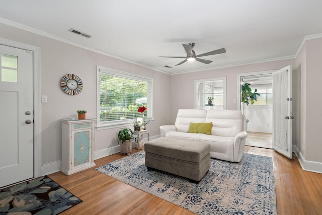 672 W Oak Forest Dr, Charleston, SC 29407 - living area with a ceiling fan, light wood-style floors, baseboards, and ornamental molding