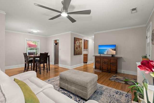 672 W Oak Forest Dr, Charleston, SC 29407 - living area featuring baseboards, wood finished floors, ceiling fan, and ornamental molding