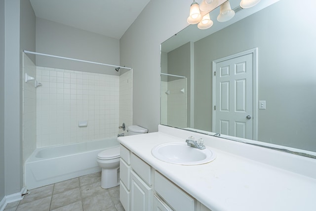 full bathroom featuring toilet, vanity, and tiled shower / bath